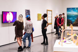 People explore a gallery in the RISD museum.