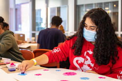 a high school student at work with ink