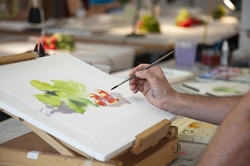 close-up of hands painting