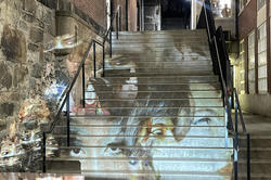 projection on the stairs outside Chace Center featuring women wearing makeup