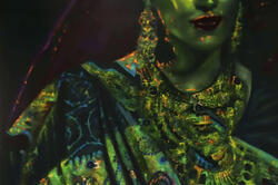 detail of tightly cropped image of woman in beautiful green sari