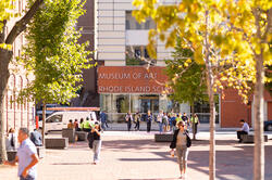 students hurrying to class through Market Square