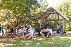 A group hangs out under a pavillion