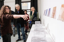 a graduate Glass student presents her work in final fall 2025 crits