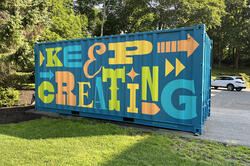 a painting that says keep creating