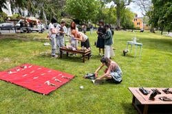 people gather outside for an art show event