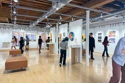 people viewing art in a gallery