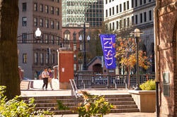 students crossing the canal on RISD's campus