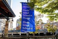 a RISD flag beside the Providence River