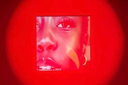 red image of a woman's eye