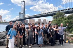a group smiles in new york for a photo
