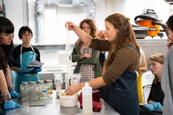 Meagan Phipps with Textiles students in the dye lab