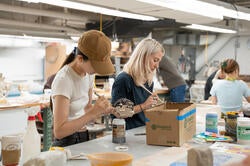 grad students at work in the ceramics studio