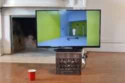 Student work by Sam Lavoie BFA 2019. Sculpture of television on top of a crate in a mostly empty room.