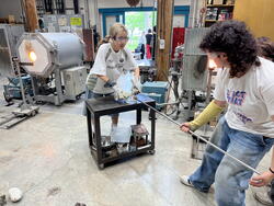 Students work with heated glass
