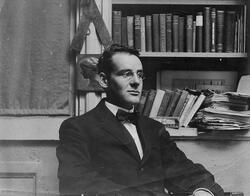 Black and white image of RISD President John R. Frazier in the Studio of Thomas Atkins, sculptor and teacher at RISD.