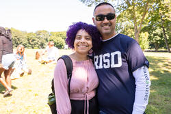two people smile for a photo