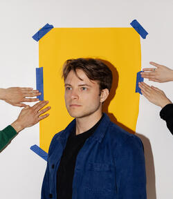 Designer Nik Bentel poses for a headshot