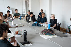 Sue Ann speaks with a class of students