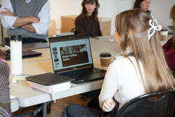 A student looks at a laptop