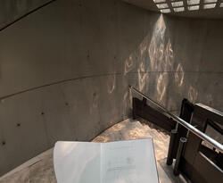 A sketchbook and a view of a staircase