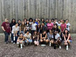 A group of students smiles for a photo