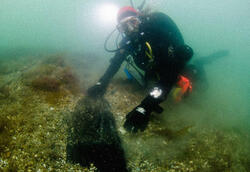 Sara Rich with the shipwreck of the Caduceus in the English Channel.