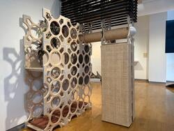 student work by Baiqiang Zhang and Holden Rappuhn displayed in a gallery