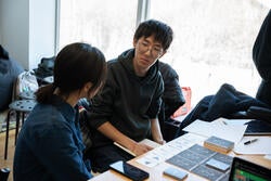 students talk about a card game