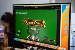 a computer screen showing the words "game over" 