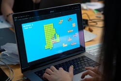 a computer with a game on it showing a green map of rhode island