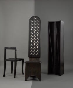 a short, minimal black wooden chair, a intricately patterned, tall wooden chair, and a narrow bifold open cabinet
