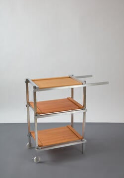 a three-level wheel-mounted cart with metal frame and brown wood shelves