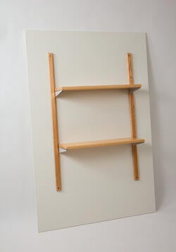 a two-shelf mounted shelving unit made from light brown wood
