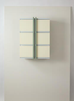a white, wall mounted open-close cabinet in closed position