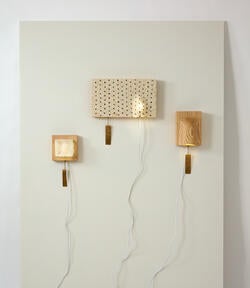 three wall-mounted sconces