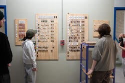 students look at paint samples