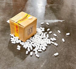 a ceramic work as a cardboard box and packing peanuts