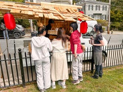 students view a mini exhibition on the back on a truck