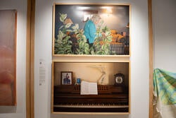 two photos hanging in an art gallery