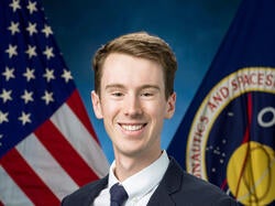 Skye Ray official NASA portrait with flags