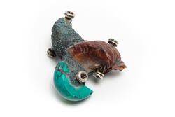 detailed view of a bolo element incorporating real and synthetic turquoise