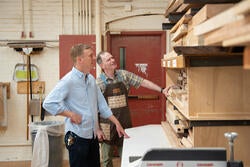Chris Specce and Jim Rosner examine stock in the woodshop