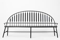 a simple Windsor-inspired settee in black