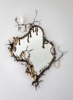 David Wiseman's Serpentine Jungle Mirror made of bronze, resin, porcelain, and mirrored glass