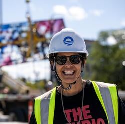 Alum Julie Mehretu on site at the Obama Presidential Center for the installation of her 83-foot glass piece Uprising of the Sun