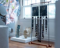 several artworks grouped together in an exhibition gallery