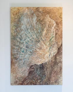 painting resembling an ocean cliff in light blue and sandy brown tones