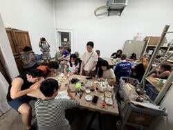 students work on ceramic pieces in china