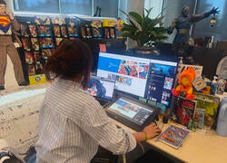Rena Yan at work on her computer at DC Comics
